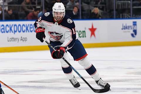 Dec 29, 2022; Elmont, New York, USA; Columbus Blue Jackets center Liam Foudy (19) skates the puck into the zone against the New York Islanders during the first period at UBS Arena. Mandatory Credit: Dennis Schneidler-USA TODAY Sports