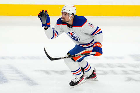 May 3, 2023; Las Vegas, Nevada, USA; Edmonton Oilers defenseman Cody Ceci (5) gloves a loose puck tipped by a Vegas Golden Knights player during the third period of game one of the second round of the 2023 Stanley Cup Playoffs at T-Mobile Arena. Mandatory Credit: Stephen R. Sylvanie-USA TODAY Sports