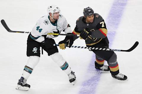 LAS VEGAS, NEVADA – NOVEMBER 21: Marc-Edouard Vlasic #44 of the San Jose Sharks battles Ryan Reaves #75 of the Vegas Golden Knights during the second period at T-Mobile Arena on November 21, 2019 in Las Vegas, Nevada. (Photo by Zak Krill/NHLI via Getty Images)