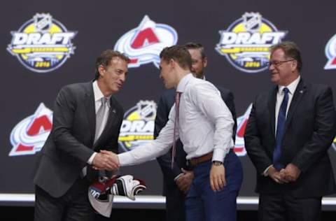 Jun 24, 2016; Buffalo, NY, USA; Tyson Jost shakes hands with Joe Sakic after being selected as the number ten overall draft pick by the Colorado Avalanche in the first round of the 2016 NHL Draft at the First Niagra Center. Mandatory Credit: Timothy T. Ludwig-USA TODAY Sports