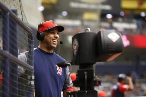 ST. PETERSBURG, FL – AUGUST 26: Manager Alex Cora #20 of the Boston Red Sox gives an on-field interview during the third inning of a game against the Tampa Bay Rays on August 26, 2018 at Tropicana Field in St. Petersburg, Florida. All players across MLB will wear nicknames on their backs as well as colorful, non-traditional uniforms featuring alternate designs inspired by youth-league uniforms during Players Weekend. (Photo by Brian Blanco/Getty Images)