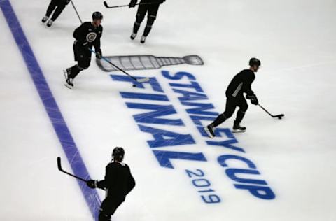 BOSTON, MA – MAY 23: Boston Bruins players skate around the Stanley Cup logo on the ice during warmups before a scrimmage ahead of the start of the 2019 NHL Stanley Cup Finals at TD Garden in Boston on May 23, 2019. (Photo by John Tlumacki/The Boston Globe via Getty Images)