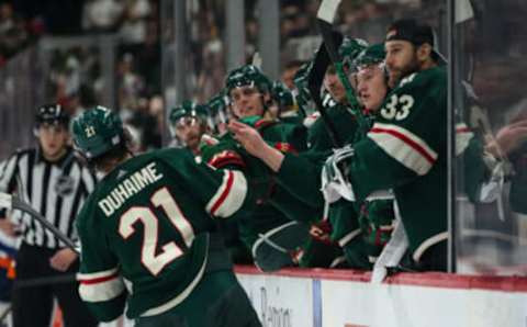 Nov 7, 2021; Saint Paul, Minnesota, USA; Minnesota Wild right wing Brandon Duhaime (21) celebrates with teammates after scoring a goal against the New York Islanders in the second period at Xcel Energy Center. Mandatory Credit: David Berding-USA TODAY Sports