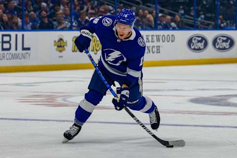 Jun 25, 2021; Tampa, Florida, USA; Tampa Bay Lightning left wing Ondrej Palat (18) passes the puck during the first period against the New York Islanders in game seven of the Stanley Cup Semifinals at Amalie Arena. Mandatory Credit: Nathan Ray Seebeck-USA TODAY Sports