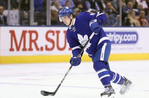 Nov 22, 2016; Toronto, Ontario, CAN; Toronto Maple Leafs center Mitch Marner (16) shoots the puck against the Carolina Hurricanes at Air Canada Centre. The Hurricanes beat the Maple Leafs 2-1. Mandatory Credit: Tom Szczerbowski-USA TODAY Sports