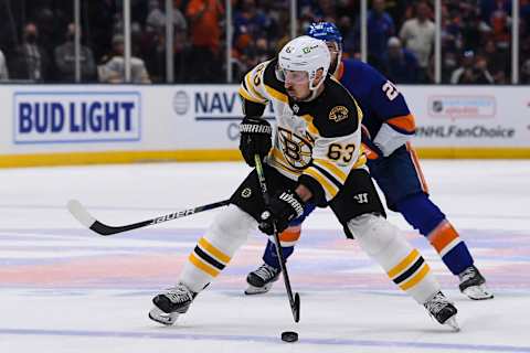 Jun 5, 2021; Uniondale, New York, USA; Boston Bruins center Brad Marchand (63) skates across the blue line against New York Islanders right wing Kyle Palmieri (21) during the third period in game four of the second round of the 2021 Stanley Cup Playoffs at Nassau Veterans Memorial Coliseum. Mandatory Credit: Dennis Schneidler-USA TODAY Sports