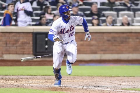 Apr 27, 2023; New York City, New York, USA; New York Mets shortstop Francisco Lindor (12) hits an RBI double in the sixth inning against the Washington Nationals at Citi Field. Mandatory Credit: Wendell Cruz-USA TODAY Sports