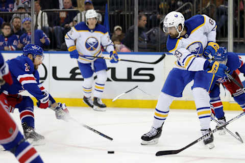 Apr 10, 2023; New York, New York, USA; New York Rangers center Barclay Goodrow (21) breaks his stick while fighting for the puck against Buffalo Sabres right wing Alex Tuch (89) during the third period at Madison Square Garden. Mandatory Credit: Brad Penner-USA TODAY Sports