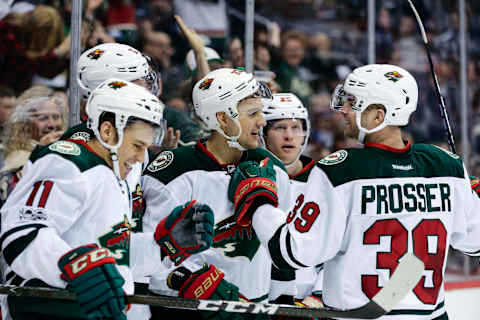 Apr 6, 2017; Denver, CO, USA; Minnesota Wild right wing Nino Niederreiter (22) celebrates with defenseman Nate Prosser (39) and center Eric Staal (12) and left wing Zach Parise (11) after his goal in the third period against the Colorado Avalanche at the Pepsi Center. The Wild won 4-3. Mandatory Credit: Isaiah J. Downing-USA TODAY Sports