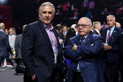 MONTREAL, QUEBEC – JULY 08: General manger Ron Francis of the Seattle Kraken and president of hockey operations Jim Rutherford of the Vancouver Canucks speak on the draft floor prior to the start of Round Two of the 2022 Upper Deck NHL Draft at Bell Centre on July 08, 2022 in Montreal, Quebec, Canada. (Photo by Bruce Bennett/Getty Images)