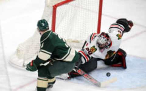 Feb 8, 2017; Saint Paul, MN, USA; Chicago Blackhawks goalie Corey Crawford (50) makes a save on the shot by Minnesota Wild forward Charlie Coyle (3) during the third period at Xcel Energy Center. The Blackhawks win 4-3 over the Wild in overtime. Mandatory Credit: Marilyn Indahl-USA TODAY Sports