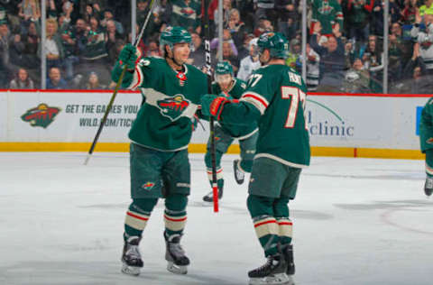 SAINT PAUL, MN – FEBRUARY 6: Brad Hunt #77 celebrates his goal with Kevin Fiala #22 of the Minnesota Wild against the Vancouver Canucks during the game at the Xcel Energy Center on February 6, 2019, in Saint Paul, Minnesota. (Photo by Bruce Kluckhohn/NHLI via Getty Images)