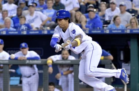 Sep 2, 2016; Kansas City, MO, USA; Kansas City Royals second baseman Raul Mondesi (27) bunts for a single in the third inning against the Detroit Tigers at Kauffman Stadium. Mandatory Credit: Denny Medley-USA TODAY Sports