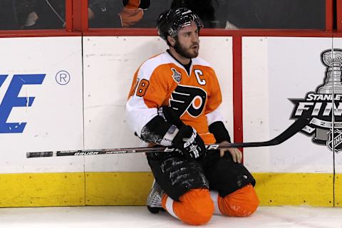 Mike Richards #18 of the Philadelphia Flyers kneels on the ice in Game Four of the 2010 NHL Stanley Cup Final. (Photo by Bruce Bennett/Getty Images)