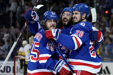 May 15, 2022; New York, New York, USA; New York Rangers left wing Chris Kreider (20) celebrates his goal against the Pittsburgh Penguins with defenseman Ryan Lindgren (55) and center Mika Zibanejad (93) during the first period of game seven of the first round of the 2022 Stanley Cup Playoffs at Madison Square Garden. Mandatory Credit: Brad Penner-USA TODAY Sports