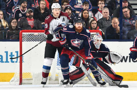 COLUMBUS, OH – MARCH 8: Nathan McKinnon #29 of the Colorado Avalanche and Ian Cole #23 of the Columbus Blue Jackets battle for position in front of goaltender Joonas Korpisalo #70 of the Columbus Blue Jackets on March 8, 2018 at Nationwide Arena in Columbus, Ohio. (Photo by Jamie Sabau/NHLI via Getty Images)