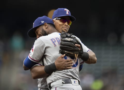 SEATTLE, WA – SEPTEMBER 30: Third baseman Adrian Belltre #29 of the Texas Rangers get a hug from Jurickson Proffar #19 of the Texas Rangers as he is replaced during the fifth inning of a game against the Seattle Mariners at Safeco Field on September 30, 2018 in Seattle, Washington. The Mariners won the game 3-1. (Photo by Stephen Brashear/Getty Images)