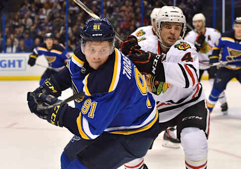 Apr 13, 2016; St. Louis, MO, USA; Chicago Blackhawks defenseman Niklas Hjalmarsson (4) pressures St. Louis Blues right wing Vladimir Tarasenko (91) during the second period in game one of the first round of the 2016 Stanley Cup Playoffs at Scottrade Center. Mandatory Credit: Jasen Vinlove-USA TODAY Sports