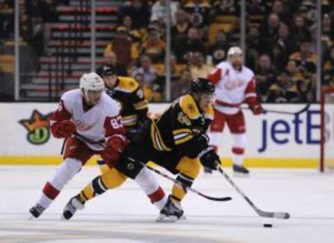 Sep 28, 2015; Boston, MA, USA; Boston Bruins left wing David Pastrnak (88) skates with the puck while Detroit Red Wings center Tomas Nosek (83) defends during the second period at TD Garden. Mandatory Credit: Bob DeChiara-USA TODAY Sports