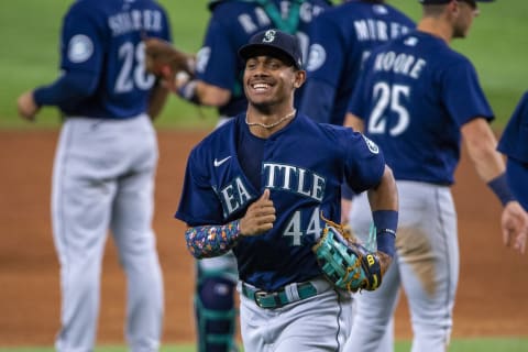 Jul 15, 2022; Arlington, Texas, USA; Seattle Mariners center fielder Julio Rodriguez (44) and the Mariners celebrate the win over the Texas Rangers at Globe Life Field. Mandatory Credit: Jerome Miron-USA TODAY Sports