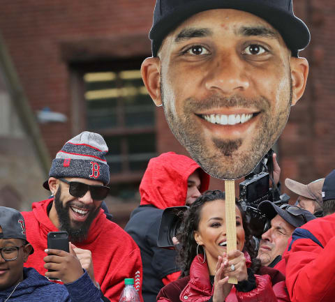 BOSTON, MA – OCTOBER 31: BOSTON, MA – OCTOBER 31: Red Sox pitcher David Prrice, in person and on a giant cardboard cutout, as the Red Sox World Series parade goes through Copley Square in Boston, MA on Oct. 31, 2018. (Photo by Jim Davis/The Boston Globe via Getty Images)