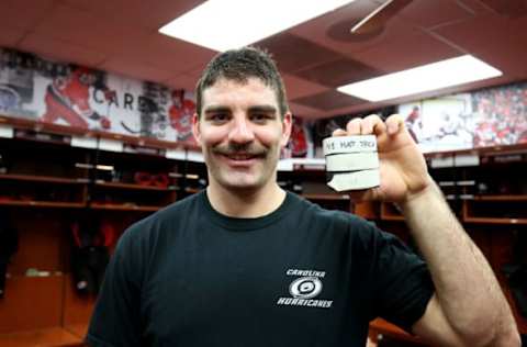 RALEIGH, NC – NOVEMBER 23: Jordan Martinook #48 of the Carolina Hurricanes is photographed with the pucks following his first NHL hat trick during an NHL game against the Florida Panthers on November 23, 2018 at PNC Arena in Raleigh, North Carolina. (Photo by Gregg Forwerck/NHLI via Getty Images)