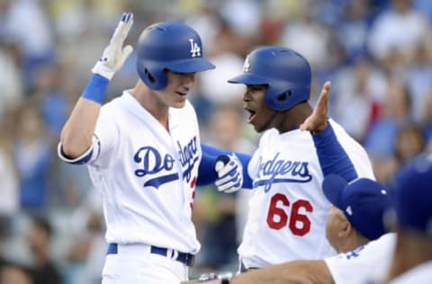 Jun 20, 2017; Los Angeles, CA, USA; Los Angeles Dodgers left fielder Cody Bellinger (35) celebrates with right fielder Yasiel Puig (66) after he hits a two run home run in the first inning against the New York Mets at Dodger Stadium. Mandatory Credit: Gary A. Vasquez-USA TODAY Sports