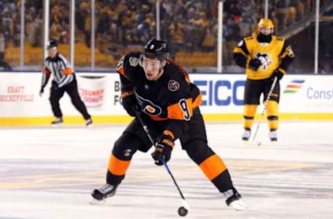 Feb 25, 2017; Pittsburgh, PA, USA; Philadelphia Flyers defenseman Ivan Provorov (9) carries the puck against the Pittsburgh Penguins during the third period in a Stadium Series hockey game at Heinz Field. The Penguins won 4-2. Mandatory Credit: Charles LeClaire-USA TODAY Sports