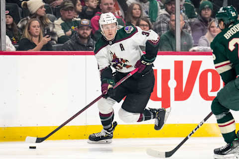 Nov 27, 2022; Saint Paul, Minnesota, USA; Arizona Coyotes right wing Christian Fischer (36) carries the puck during the first period against the Minnesota Wild at Xcel Energy Center. Mandatory Credit: Brace Hemmelgarn-USA TODAY Sports