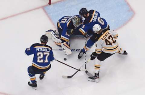 ST. LOUIS, MO – JUNE 3: Jordan Binnington #50 Alex Pietrangelo #27 and Joel Edmundson #6 of the St. Louis Blues defend the net against Danton Heinen #43 of the Boston Bruins in Game Four of the 2019 NHL Stanley Cup Final at Enterprise Center on June 3, 2019 in St. Louis, Missouri. (Photo by Joe Puetz/NHLI via Getty Images)