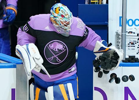 BUFFALO, NY – MARCH 18: Carter Hutton #40 of the Buffalo Sabres steps to the ice wearing a Hockey Fights Cancer jersey before the game against the Boston Bruins at KeyBank Center on March 18, 2021 in Buffalo, New York. (Photo by Kevin Hoffman/Getty Images)