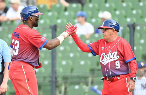 Yadir Drake of Team Cuba celebrates an RBI single against Panama. (Photo by Gene Wang/Getty Images)