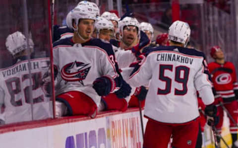 Jan 13, 2022; Raleigh, North Carolina, USA; Columbus Blue Jackets right wing Yegor Chinakhov (59) scores a goal against the Carolina Hurricanes during the second period at PNC Arena. Mandatory Credit: James Guillory-USA TODAY Sports