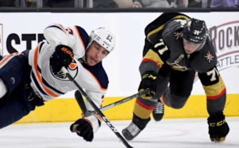 LAS VEGAS, NV – JANUARY 13: Milan Lucic #27 of the Edmonton Oilers and William Karlsson #71 of the Vegas Golden Knights fight for the puck in the third period of their game at T-Mobile Arena on January 13, 2018 in Las Vegas, Nevada. The Oilers won 3-2 in overtime. (Photo by Ethan Miller/Getty Images)