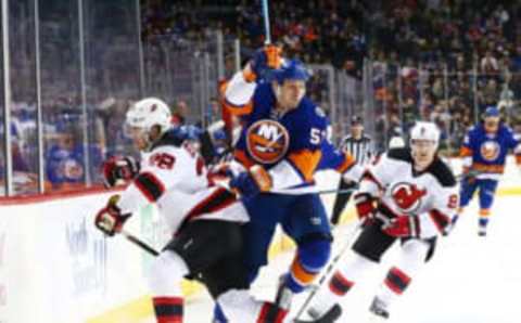 Dec 13, 2015; Brooklyn, NY, USA; New York Islanders center Casey Cizikas (53) and New Jersey Devils defenseman Damon Severson (28) collide during the second period at Barclays Center. Mandatory Credit: Andy Marlin-USA TODAY Sports