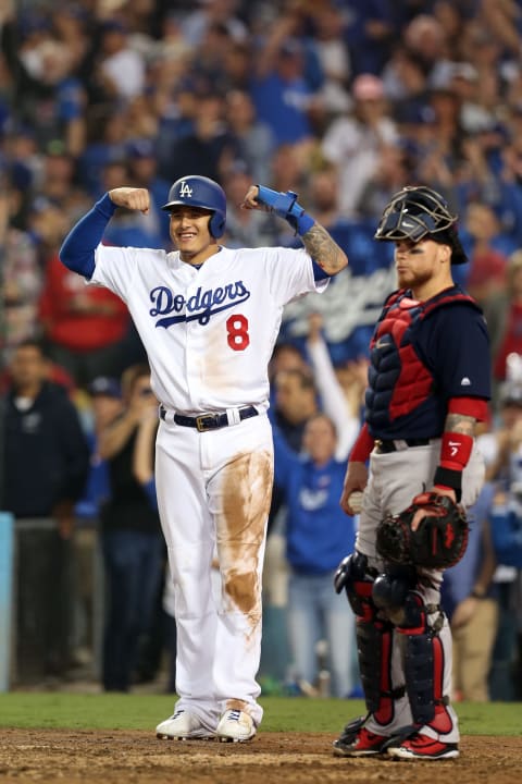 LOS ANGELES, CA – OCTOBER 27: Manny Machado #8 of the Los Angeles Dodgers waits for Yasiel Puig #66 at home plate after Puig hit a three-run home run in the sixth inning during Game 4 of the 2018 World Series against the Boston Red Sox at Dodger Stadium on Saturday, October 27, 2018 in Los Angeles, California. (Photo by Rob Leiter/MLB Photos via Getty Images)