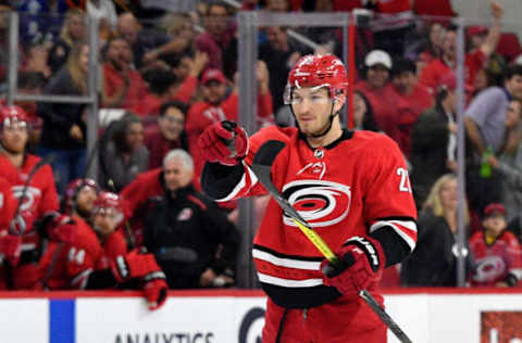 RALEIGH, NC – OCTOBER 09: Brett Pesce #22 of the Carolina Hurricanes reacts after scoring a goal against the Vancouver Canucks during the first period of their game at PNC Arena on October 9, 2018 in Raleigh, North Carolina. (Photo by Grant Halverson/Getty Images)