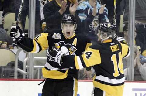 Nov 8, 2016; Pittsburgh, PA, USA; Pittsburgh Penguins center Evgeni Malkin (71) celebrates his goal with left wing Chris Kunitz (14) against the Edmonton Oilers during the third period at the PPG Paints Arena. The Penguins won 4-3. Mandatory Credit: Charles LeClaire-USA TODAY Sports