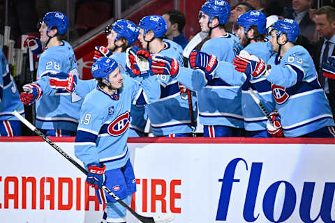 MONTREAL, CANADA – JANUARY 31: Rafael Harvey-Pinard #49 of the Montreal Canadiens celebrates his goal with teammates on the bench during the third period against the Ottawa Senators at Centre Bell on January 31, 2023 in Montreal, Quebec, Canada. The Ottawa Senators defeated the Montreal Canadiens 5-4. (Photo by Minas Panagiotakis/Getty Images)