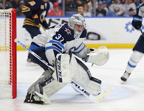 BUFFALO, NY – FEBRUARY 23: Connor Hellebuyck #37 of the Winnipeg Jets looks for the puck during the second period against the Buffalo Sabres at KeyBank Center on February 23, 2020 in Buffalo, New York. (Photo by Timothy T Ludwig/Getty Images)