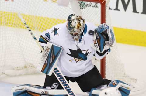 Mar 6, 2017; Winnipeg, Manitoba, CAN; San Jose Sharks goalie Aaron Dell (30) makes a save during the second period against the Winnipeg Jets at MTS Centre. Mandatory Credit: Bruce Fedyck-USA TODAY Sports