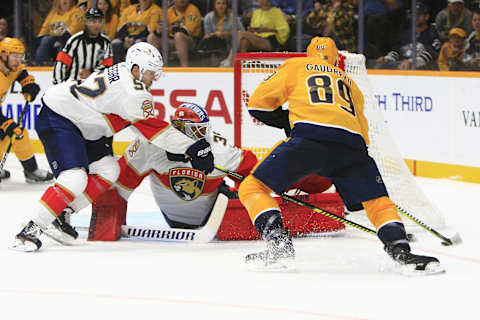 NASHVILLE, TN – SEPTEMBER 16: Nashville Predators center Frederick Gaudreau (89) corrals the loose puck in front of Panthers goalie Ryan Bednard (35) as defenseman MacKenzie Weegar (52) defends during the second NHL preseason game between the Nashville Predators and Florida Panthers, held on September 16, 2019, at Bridgestone Arena in Nashville, Tennessee. (Photo by Danny Murphy/Icon Sportswire via Getty Images)