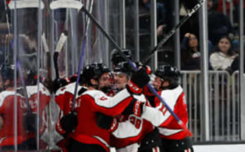 BOSTON, MA – FEBRUARY 6: Hunter McDonald #5 of the Northeastern Huskies celebrates his empty-net goal against the Boston University Terriers with teammates Jayden Struble #3, Justin Hryckowian #29, Gunnarwolfe Fontaine #11 and Jakov Novak #10 during the third period during NCAA hockey in the semifinals of the annual Beanpot Hockey Tournament at TD Garden on February 6, 2023 in Boston, Massachusetts. The Huskies won 3-1. (Photo by Richard T Gagnon/Getty Images)