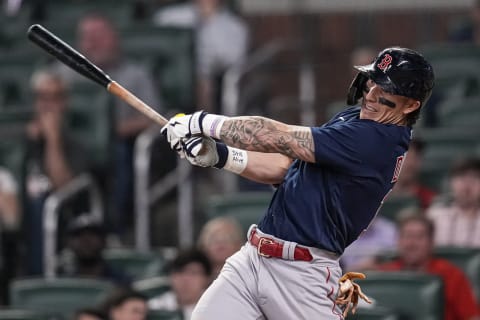 May 10, 2023; Cumberland, Georgia, USA; Boston Red Sox center fielder Jarren Duran (16) hits a double against the Atlanta Braves during the ninth inning at Truist Park. Mandatory Credit: Dale Zanine-USA TODAY Sports