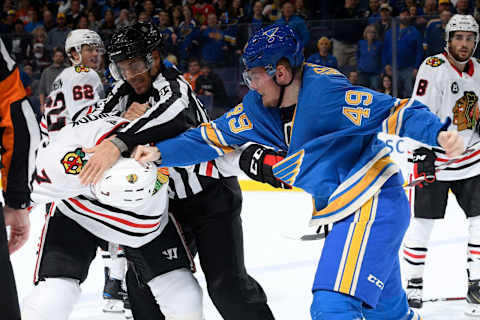 ST. LOUIS, MO – OCTOBER 27: Ivan Barbashev #49 of the St. Louis Blues and Brent Seabrook #7 of the Chicago Blackhawks fight at Enterprise Center on October 27, 2018 in St. Louis, Missouri. (Photo by Scott Rovak/NHLI via Getty Images)