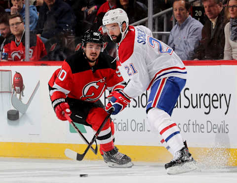 NEWARK, NEW JERSEY – NOVEMBER 21: David Schlemko Montreal Canadiens Karl Alzner Jordie Benn (Photo by Elsa/Getty Images)