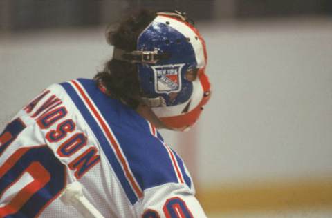 Canadian hockey player John Davidson, goalkeeper for the New York Rangers, on the ice during a game, late 1970s or early 1980s. (Photo by Bruce Bennett Studios/Getty Images)