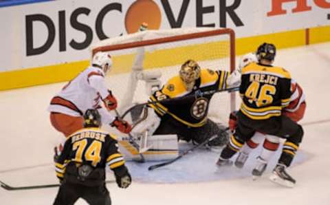 Aug 13, 2020; Toronto, Ontario, CAN; Boston Bruins goaltender Tuukka Rask (40) blocks the shot of Carolina Hurricanes left wing Warren Foegele (13) during the second period in game two of the first round of the 2020 Stanley Cup Playoffs at Scotiabank Arena. Mandatory Credit: Dan Hamilton-USA TODAY Sports