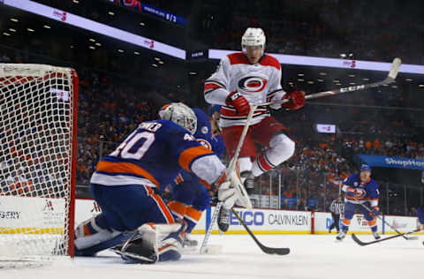 NEW YORK, NEW YORK – APRIL 28: Robin Lehner #40 of the New York Islanders makes a pad save in front of Saku Maenalanen #8 of the Carolina Hurricanes during Game Two of the Eastern Conference Second Round during the 2019 Stanley Cup Playoffs at Barclays Center on April 28, 2019 in New York City. (Photo by Mike Stobe/NHLI via Getty Images)