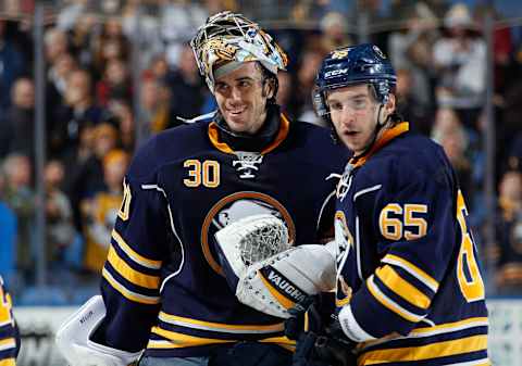 BUFFALO, NY – DECEMBER 23: Brian Flynn #65 and Ryan Miller #30 of the Buffalo Sabres celebrate their 2-1 victory over the Phoenix Coyotes at First Niagara Center on December 23, 2013 in Buffalo, New York. (Photo by Jen Fuller/Getty Images)